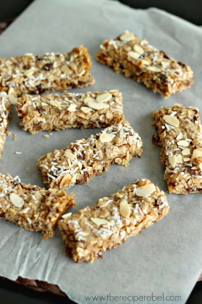 peanut butter granola bars cut into bars on parchment paper