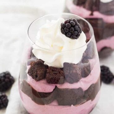 Chocolate Blackberry Cheesecake Trifles: Chocolate cake or brownies layered with no-bake blackberry cheesecake and homemade chocolate pudding -- a rich, chocolatey, fruity dessert that's perfect any time of the year! Make from scratch or use optional shortcuts to keep things quick and easy! www.thereciperebel.com