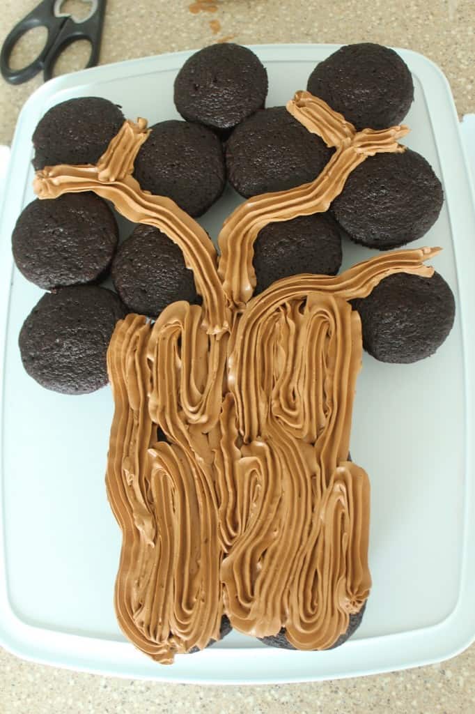 brown frosting on chocolate cupcakes showing tree trunk