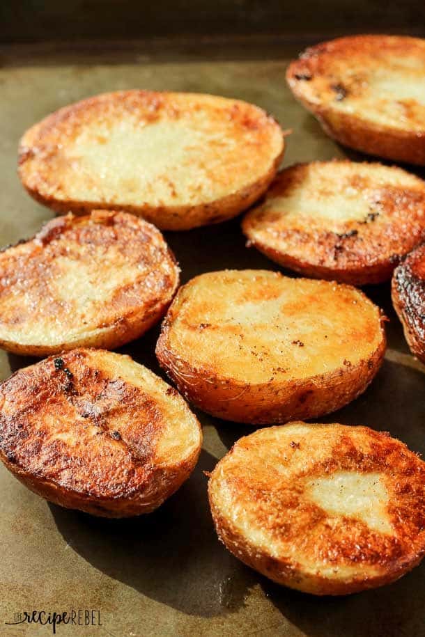 close up image of crispy roasted potatoes on sheet pan