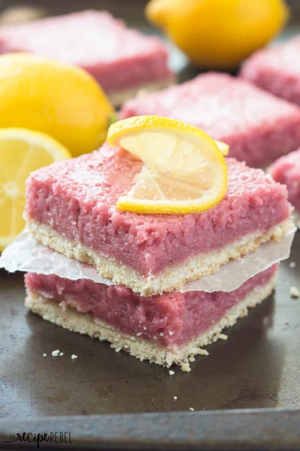 stack of two strawberry pineapple lemonade squares topped with lemon slice