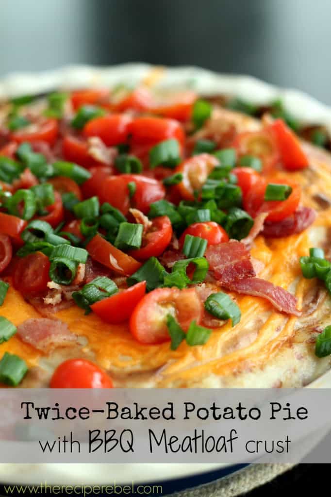 close up image of twice baked potato pie with meat loaf crust topped with tomatoes bacon and green onions