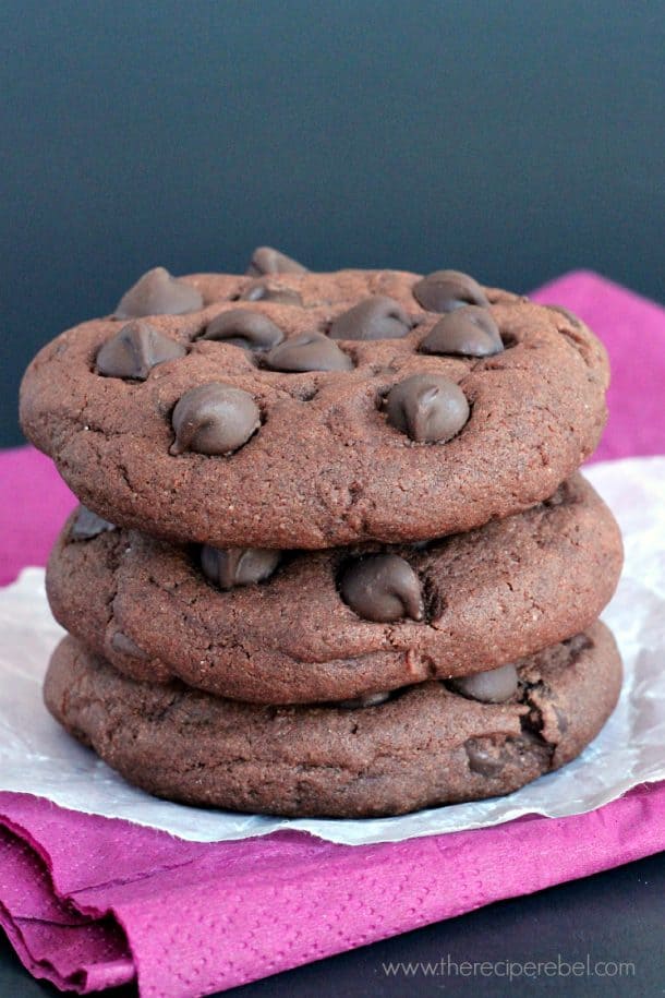 stack of three triple chocolate pudding cookies with chocolate chips on top