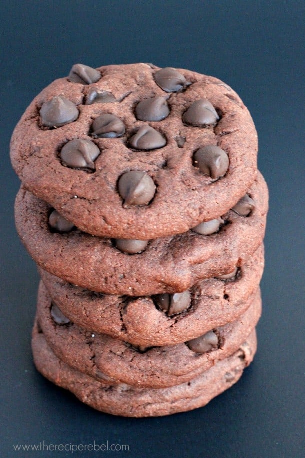 stack of five triple chocolate pudding cookies on black background
