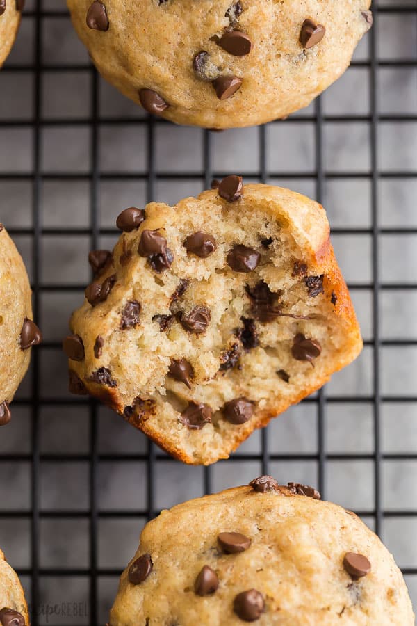 healthy banana muffins with chocolate chips close up with bite taken out 