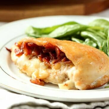 Bacon Jam Stuffed Chicken Breasts: Juicy chicken stuffed with mozzarella cheese and maple bacon jam - the best stuffed chicken you've ever had! www.thereciperebel.com