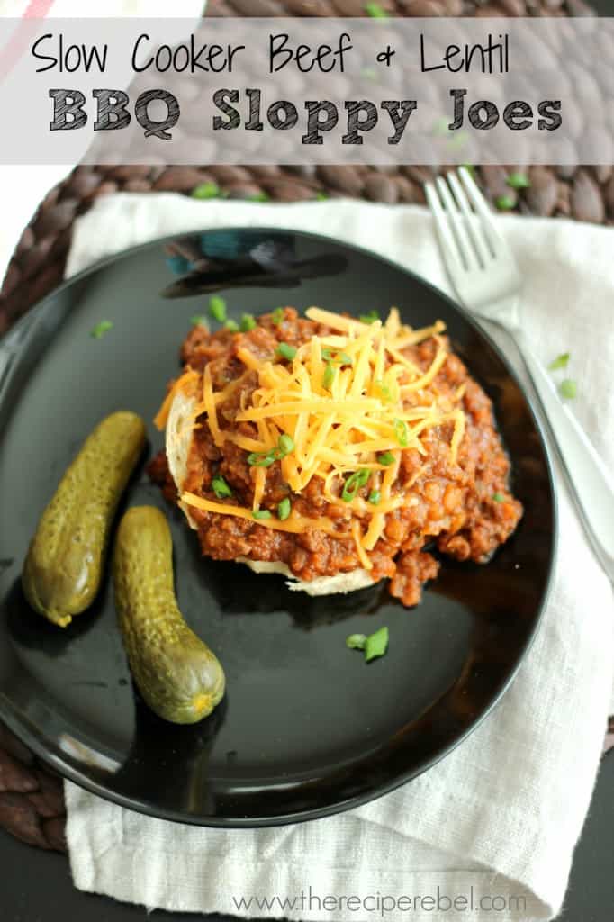 slow cooker beef and lentil sloppy joes on white bun on black plate