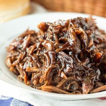 Slow Cooker Honey Balsamic Pulled Pork:Incredible thick, sweet and tangy honey balsamic sauce over slow-cooked pulled pork -- my absolute favorite way to do pulled pork! Perfect crockpot meal for summer or a busy weeknight! www.thereciperebel.com