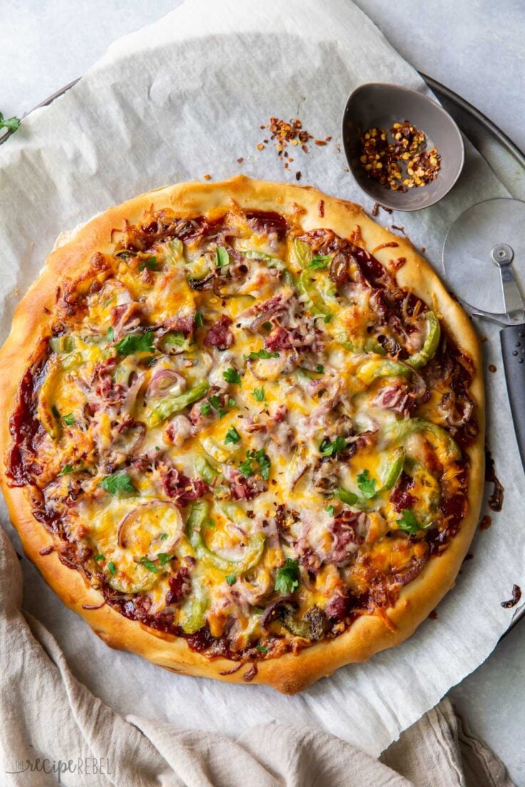 overhead image of full philly cheesteak pizza