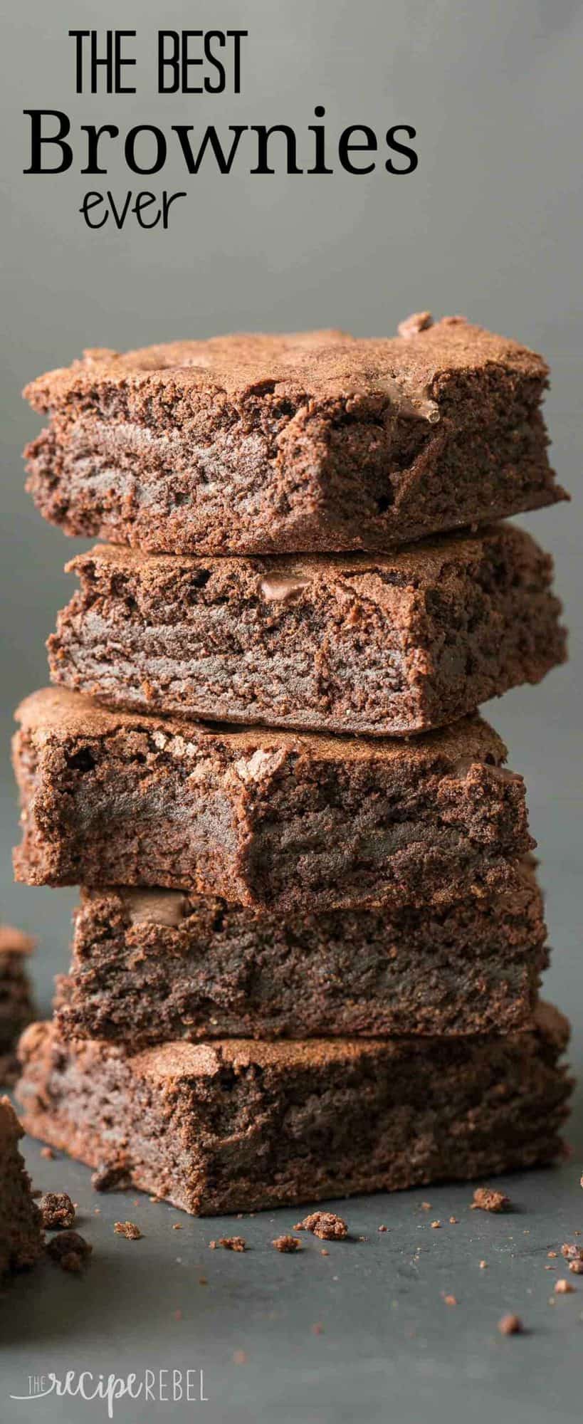 stack of five fudgy brownies with a bite taken out of middle brownie