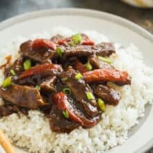 This Slow Cooker Mongolian Beef is so quick and easy -- throw everything in the crockpot and let it cook! Tender strips of steak, covered in a rich, dark sauce full of Asian flavours with a touch of sweetness. #slowcooker #crockpot #beef #mongolian #aisain #chinese