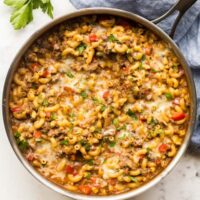 one pot hamburger helper overhead on white background in stainless steel pan