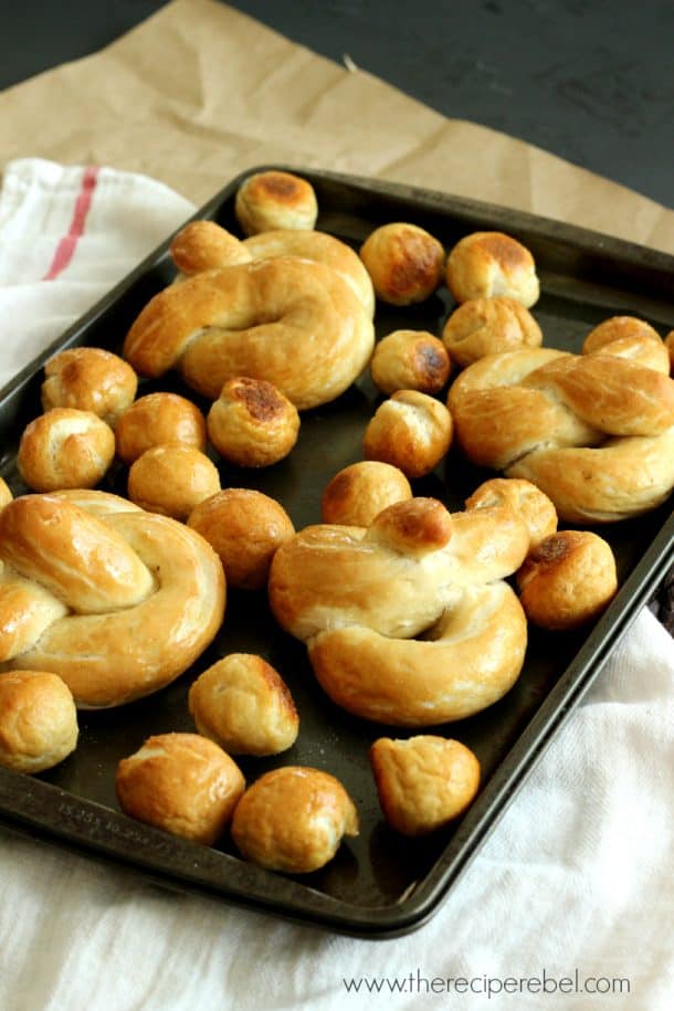 soft pretzels and soft pretzel bites on dark sheet pan