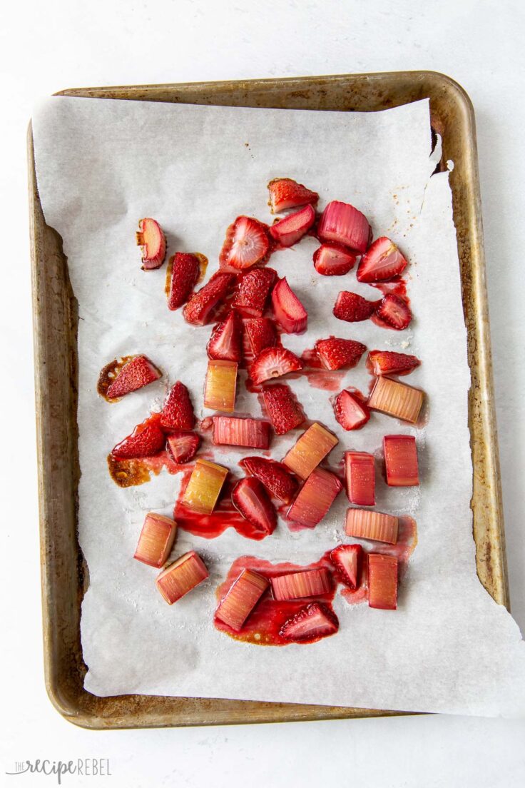 strawberries and rhubarb on baking sheet after roasting