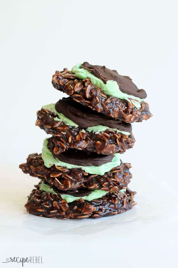 stack of four mint chocolate no bake cookies leaning to the right side on a white background