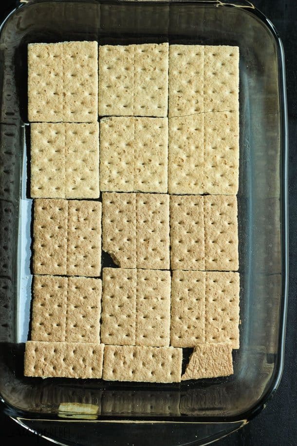 9 by 13 inch glass baking dish lined with whole graham crackers