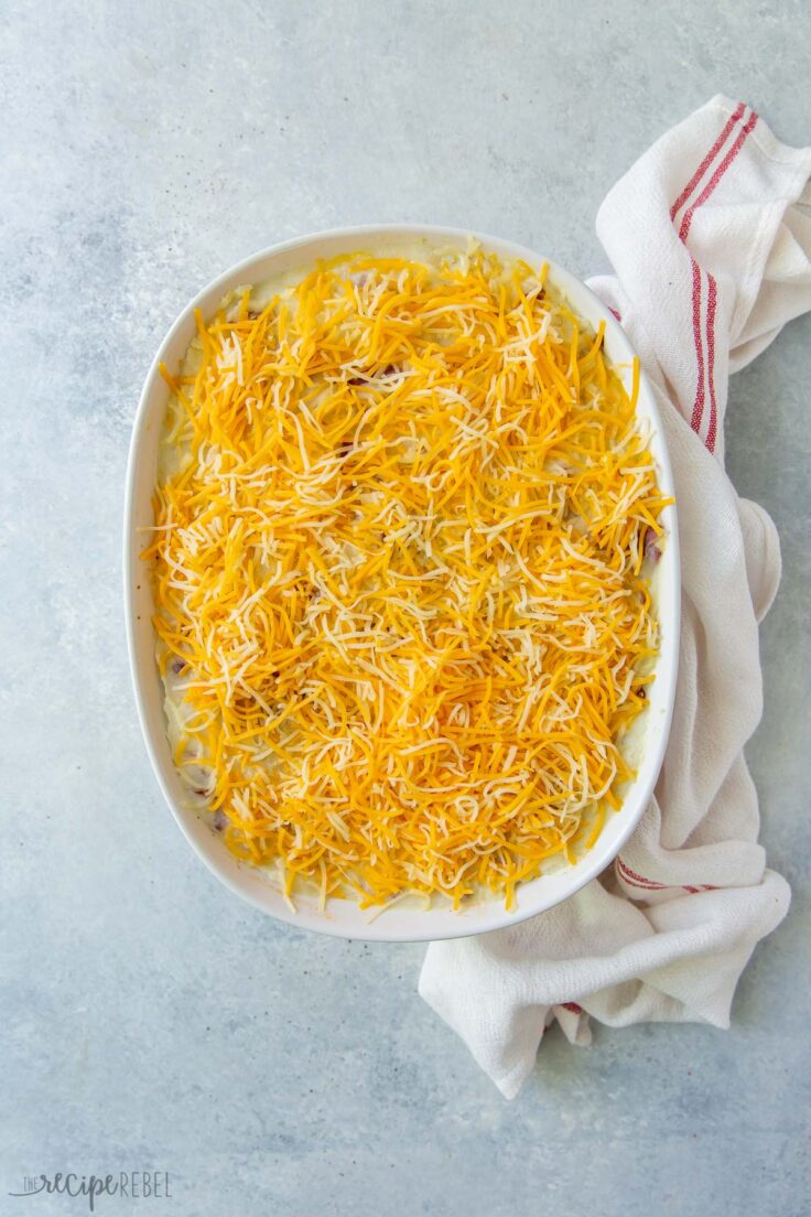 shredded cheese on top of mashed potatoes for shepherds pie