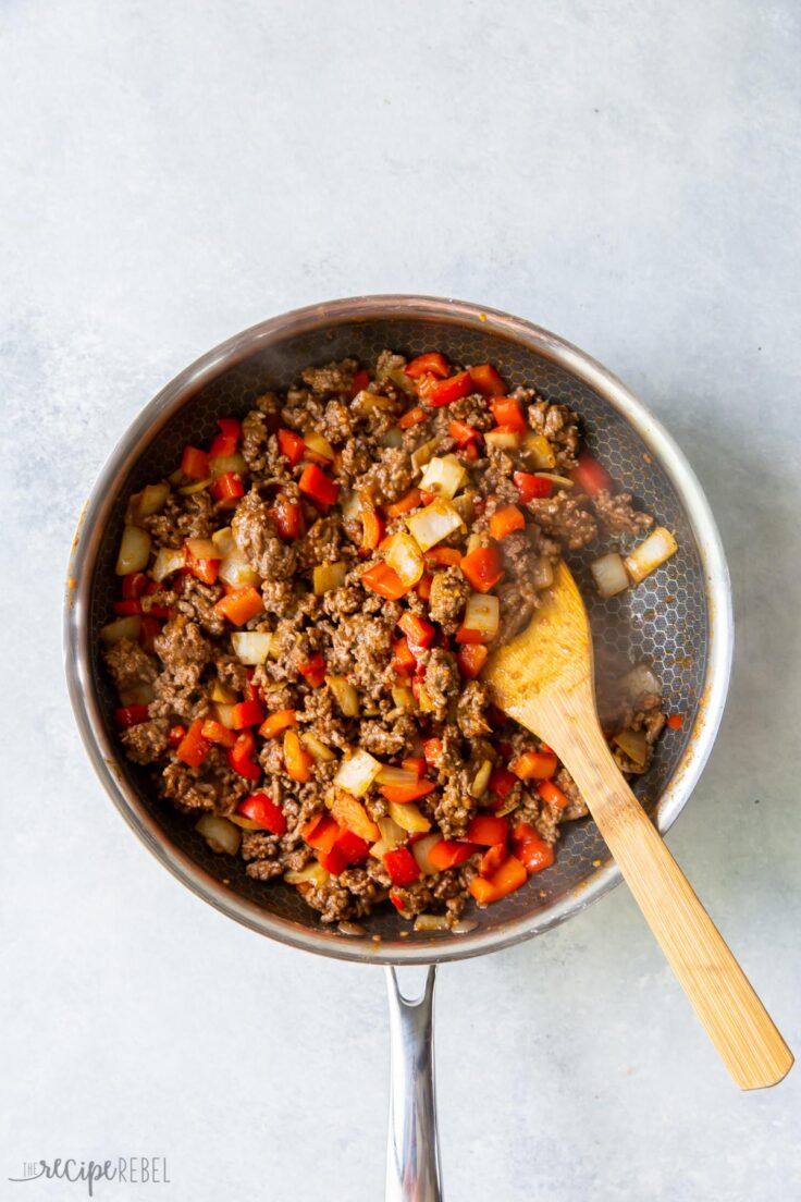 mexican shepherds pie filling being cooked in pan