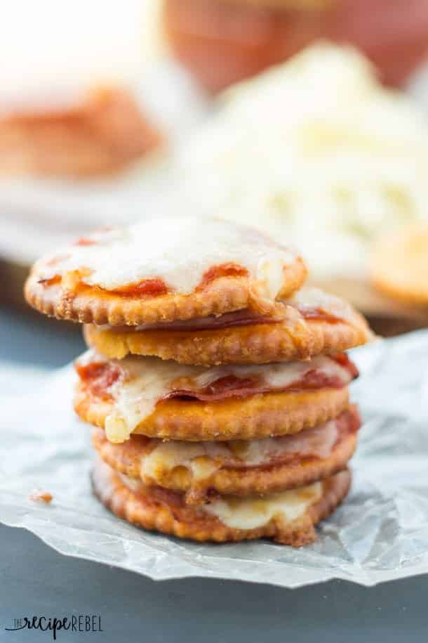 Pizza Crackers: The easiest 4-ingredient snack, appetizer or lunch for the kids! Easily change them to your tastes. Less than 10 minutes start to finish! www.thereciperebel.com