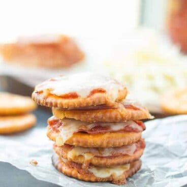 Pizza Crackers: The easiest 4-ingredient snack, appetizer or lunch for the kids! Easily change them to your tastes. Less than 10 minutes start to finish! www.thereciperebel.com