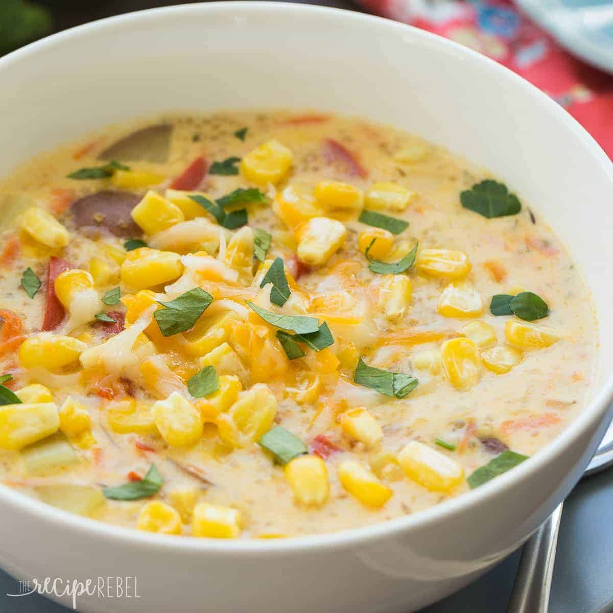 close up image of bowl of quinoa corn chowder sprinkled with fresh parsley