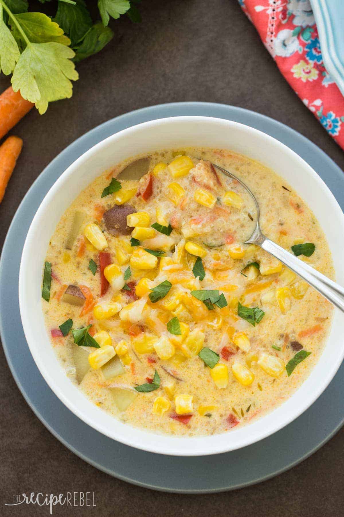 overhead image of bowl of quinoa corn chowder with spoon in soup