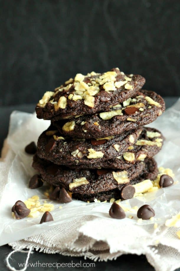 stack of double chocolate chip cookies topped with plain potato chips