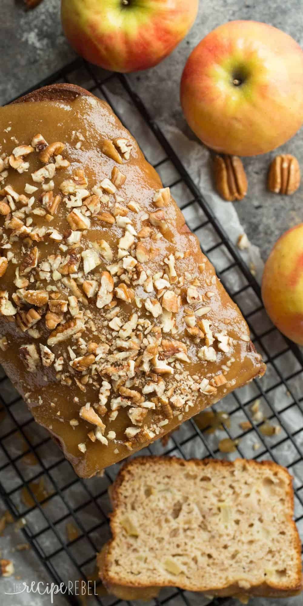 long overhead image of caramel apple bread on black cooling rack with one slice cut