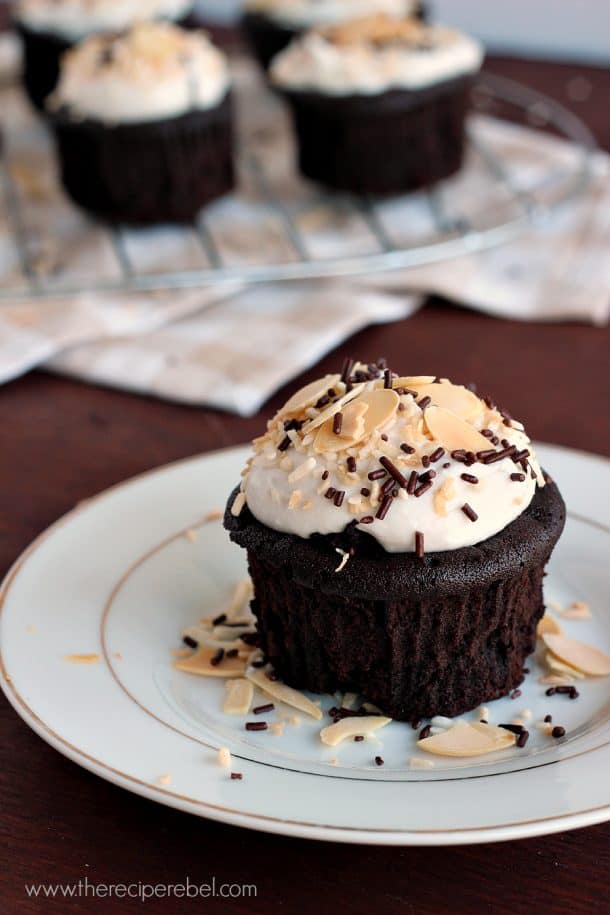 chocolate cupcakes with whipped coconut cream sprinkles and almonds
