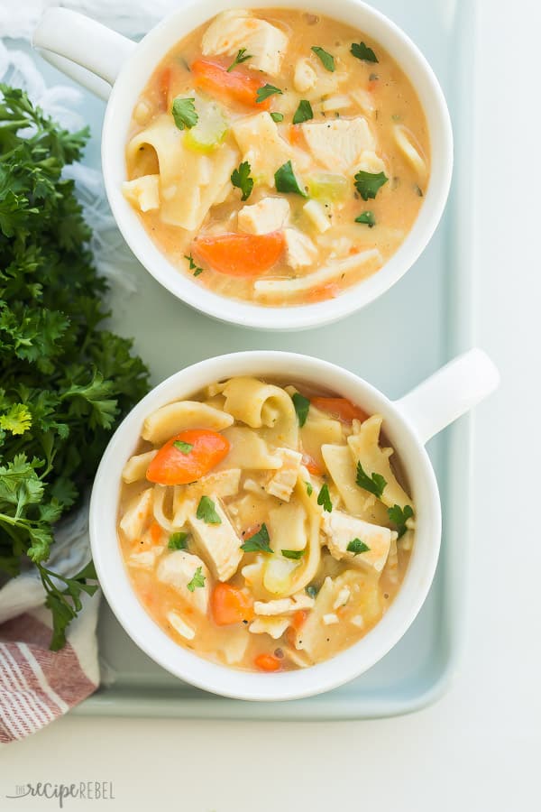 slow cooker creamy chicken noodle soup in mugs
