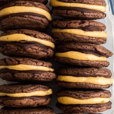 chocolate pumpkin oreos lined up in glass baking dish