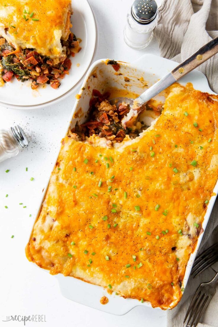 casserole dish of meat lovers shepherds pie with metal scoop