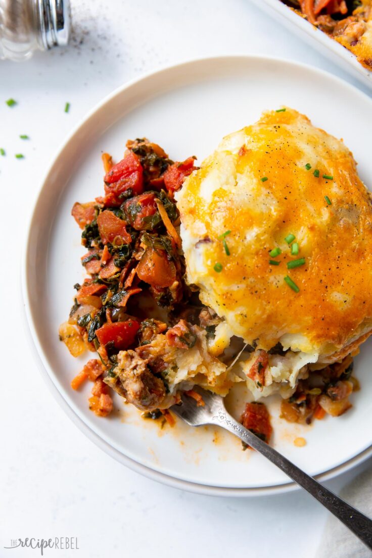 overhead image of meat lovers shepherds pie on white plate