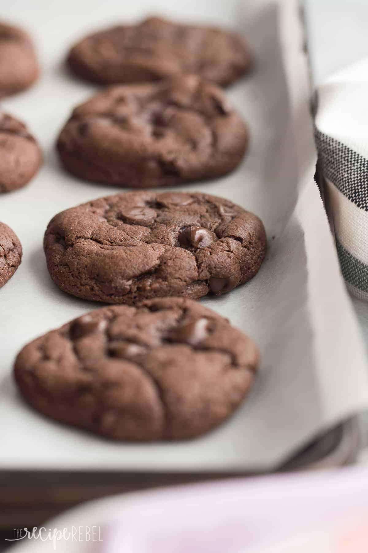 four ingredient cake mix cookies on sheet pan with parchment paper