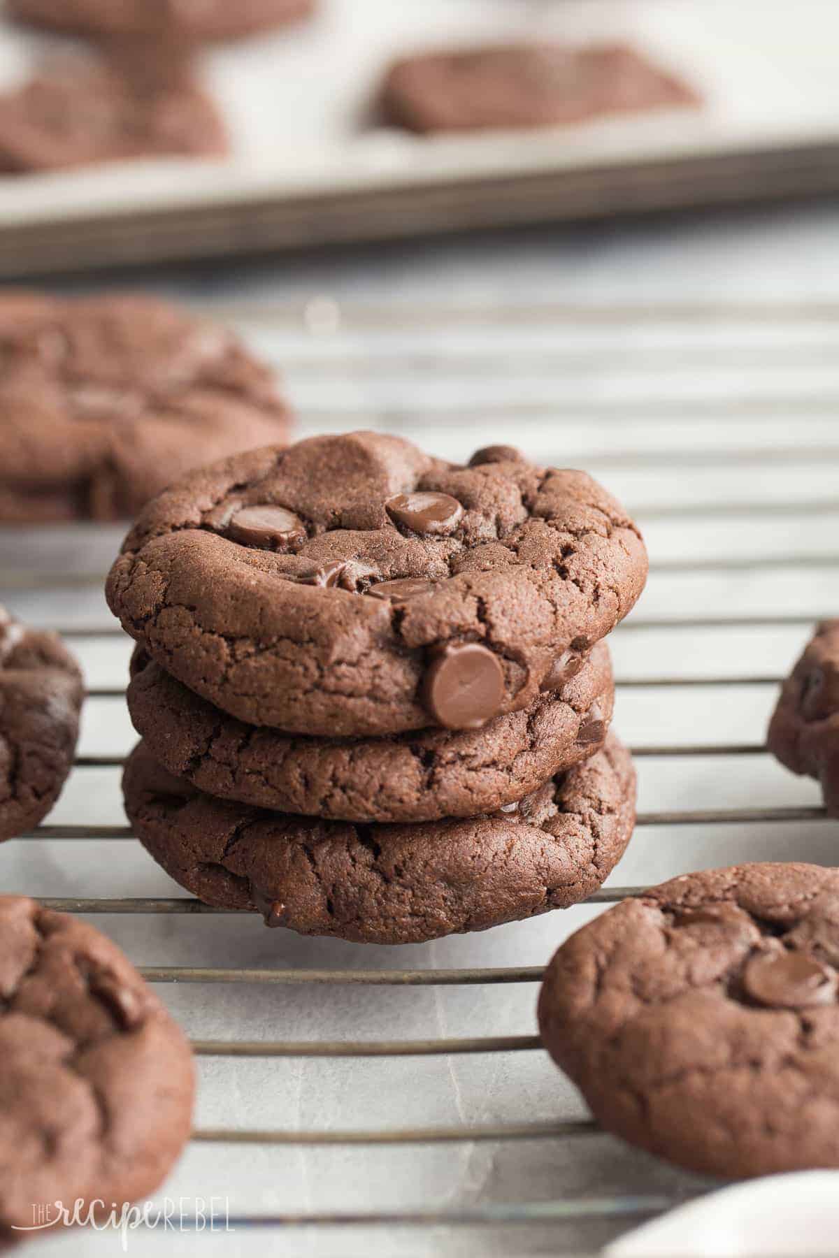 stack of three double chocolate cake mix cookies on wire rack