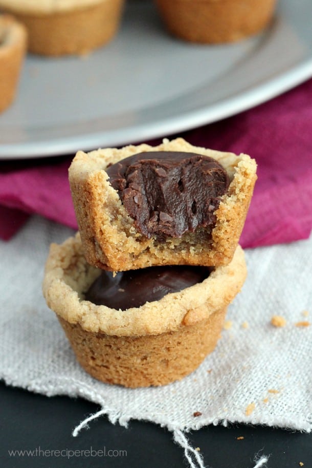 close up of two fudge puddles stacked with bite out of top cookie cup