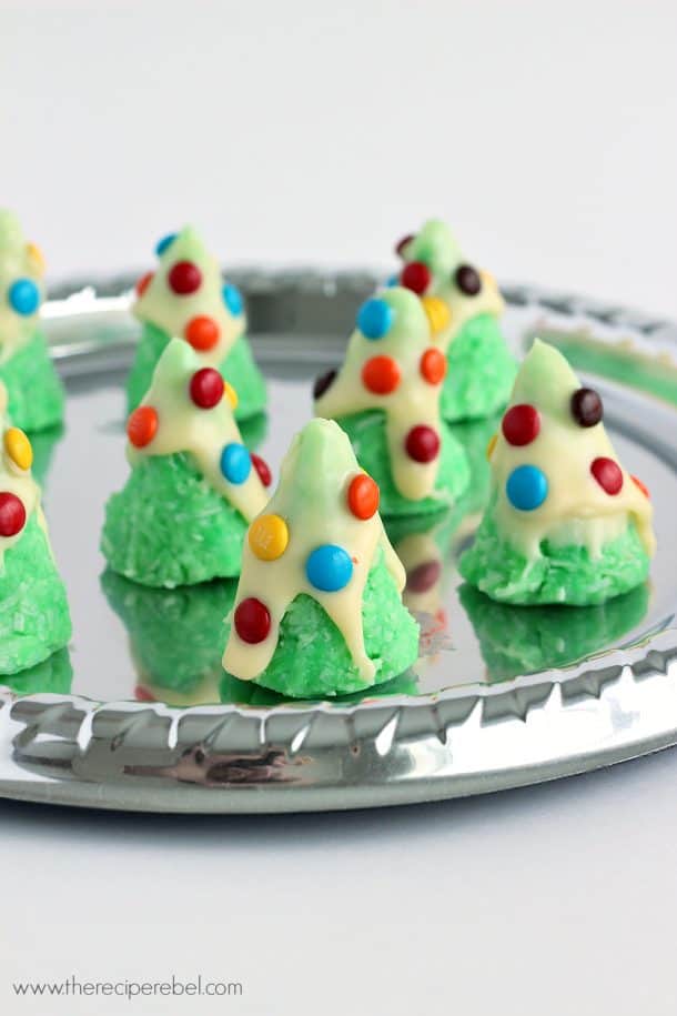 green no bake cookies in cone shape decorate with white chocolate snow and m&ms
