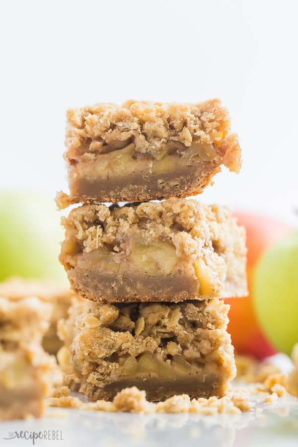 apple crisp bars stack of 3 bars with apples in the background