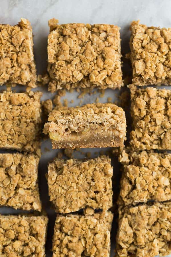apple crisp blondies overhead cut into squares with one square tilted on its side