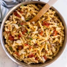 overhead image of one pot italian sausage pasta in pan