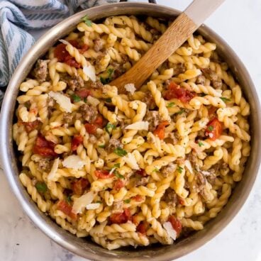 overhead image of one pot italian sausage pasta in pan