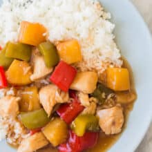 slow cooker sweet and sour chicken on blue plate