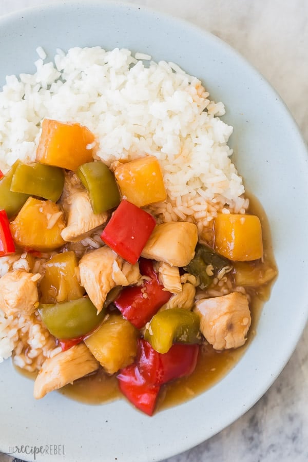 slow cooker sweet and sour chicken on blue plate