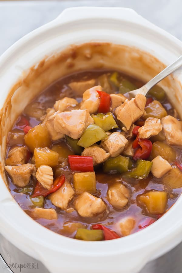 slow cooker sweet and sour chicken in crockpot with pineapple and peppers
