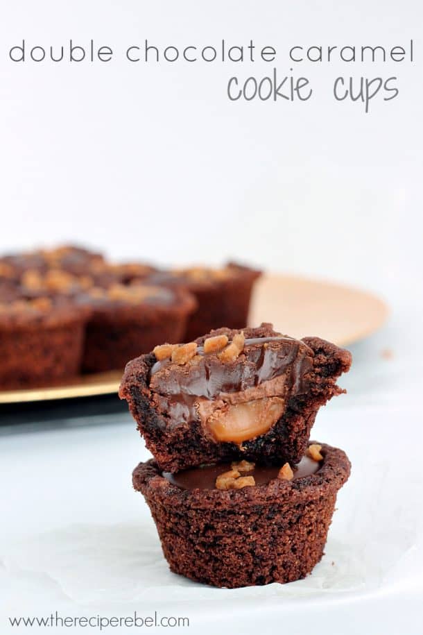 two cookie cups stacked with bite taken from the top cookie cup and oozing caramel