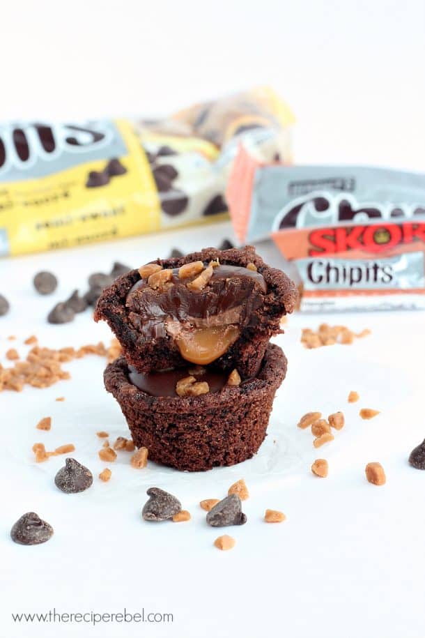 chocolate caramel cookie cups stacked with bite taken out of top cookie cup