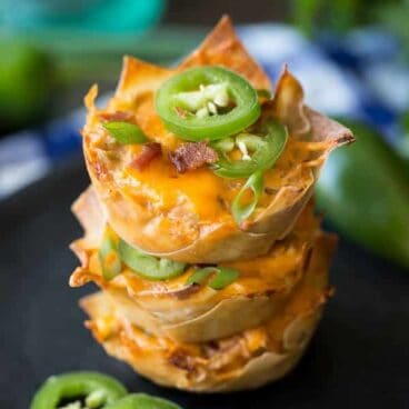 Creamy, spicy Jalapeno Poppers loaded with bacon, chicken and barbecue sauce, stuffed into a crispy wonton cup!