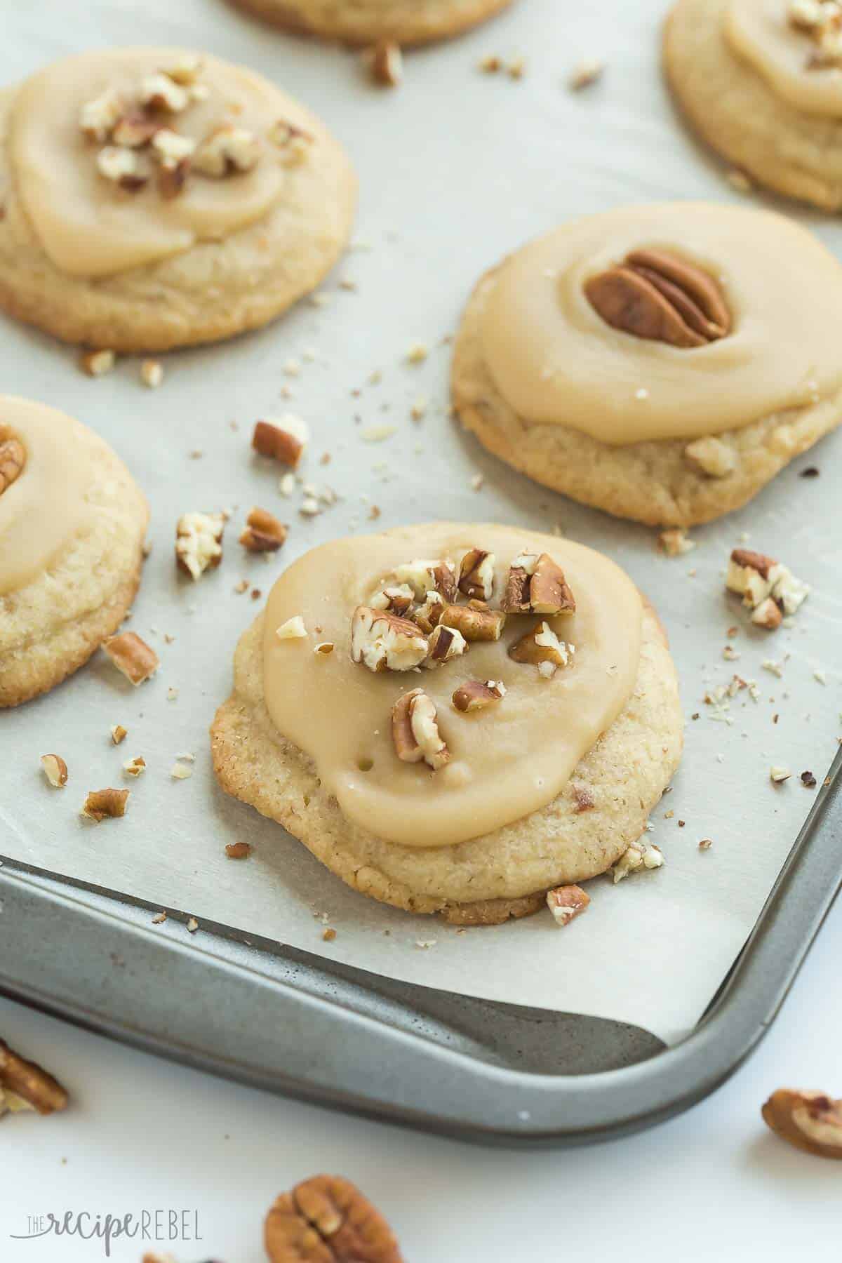 brown sugar pecan cookies on a sheet pan lined with parchment paper