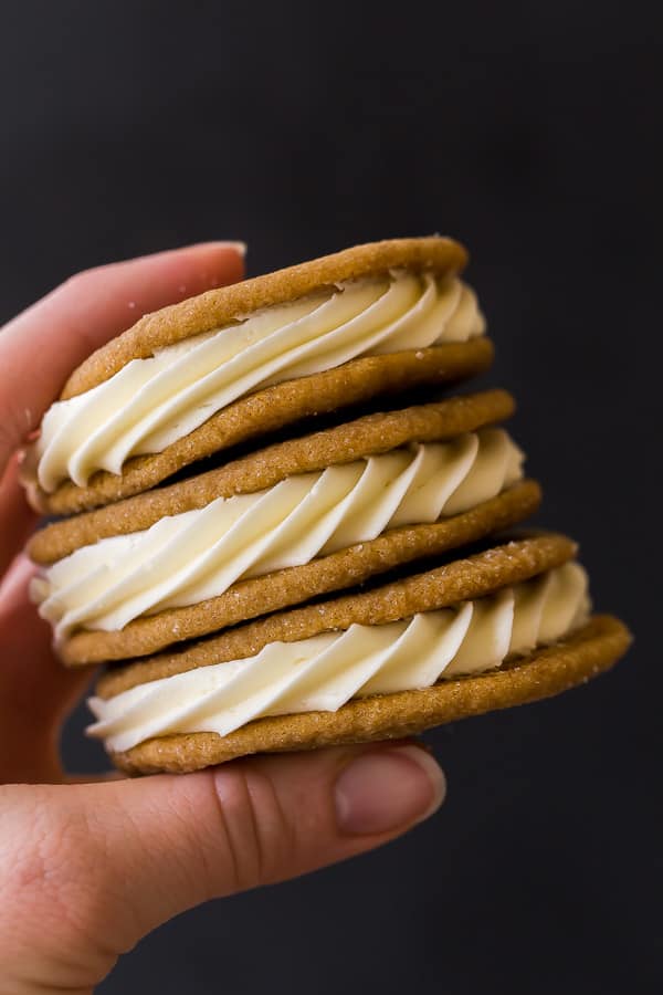 stack of 3 gingersnap sandwich cookies in hand