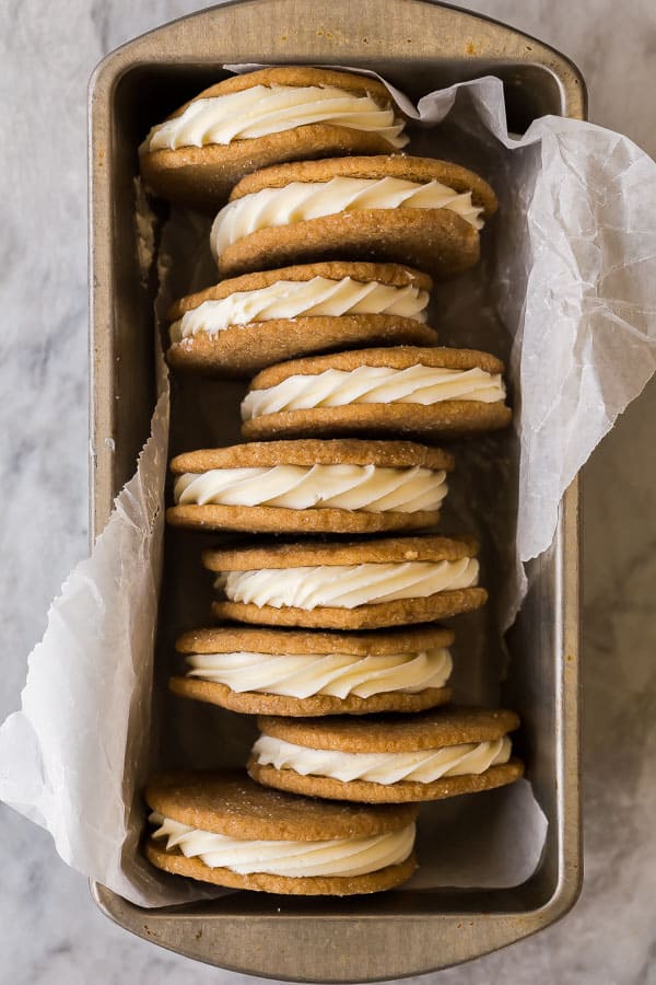 gingersnap sandwich cookies lined up in metal loaf pan